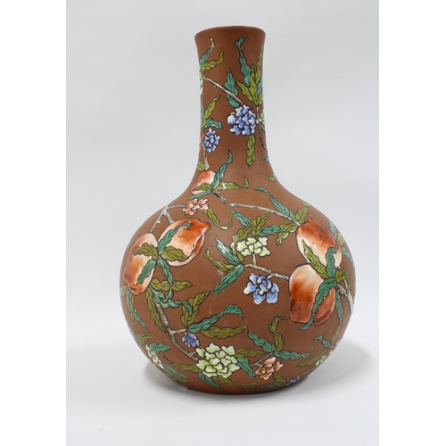 140 - Terracotta vase with enamelled floral decoration, 34cm