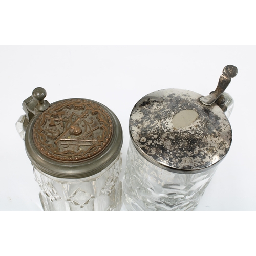 141 - Masonic pewter lidded glass tankard and a Munros Peerage Scotch tankard with Epns cover, 16cm  (2)