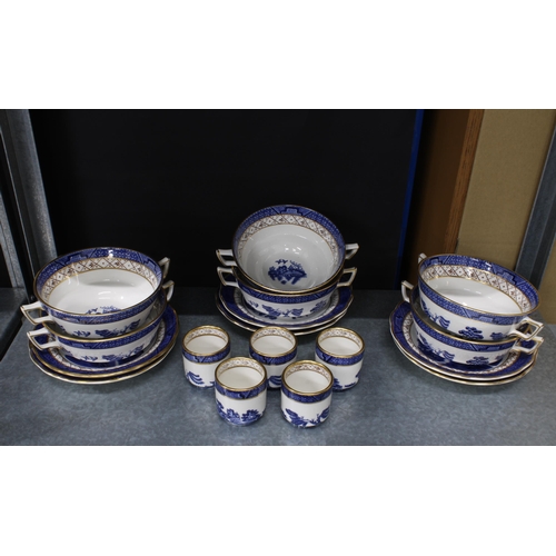 150 - Willow pattern blue and white dinner service and teaset together with a vase, candlesticks, etc tall... 