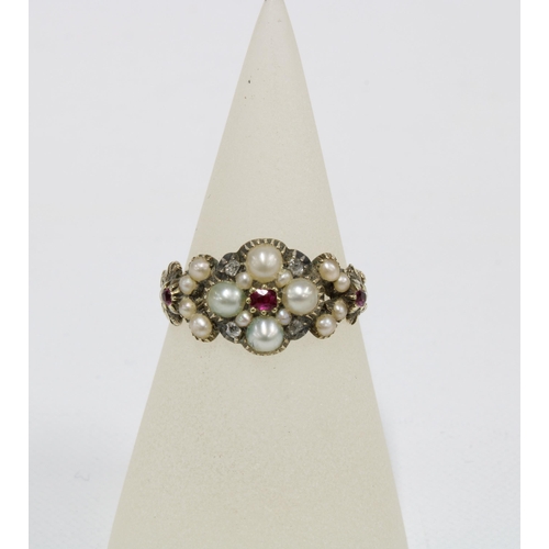20 - 19th century ruby, pearl and diamond mourning ring with a flowerhead setting of four pearls and four... 