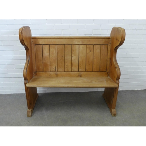 207 - Panelled pine two seater highback settle. 111 x 118 x 52cm.