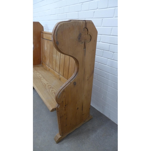 207 - Panelled pine two seater highback settle. 111 x 118 x 52cm.