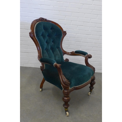 212 - Victorian mahogany framed open armchair, button back green upholstery on ceramic castors. 102 x 71 x... 