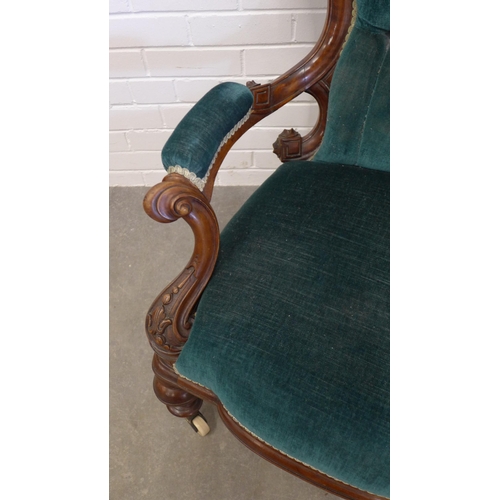 212 - Victorian mahogany framed open armchair, button back green upholstery on ceramic castors. 102 x 71 x... 