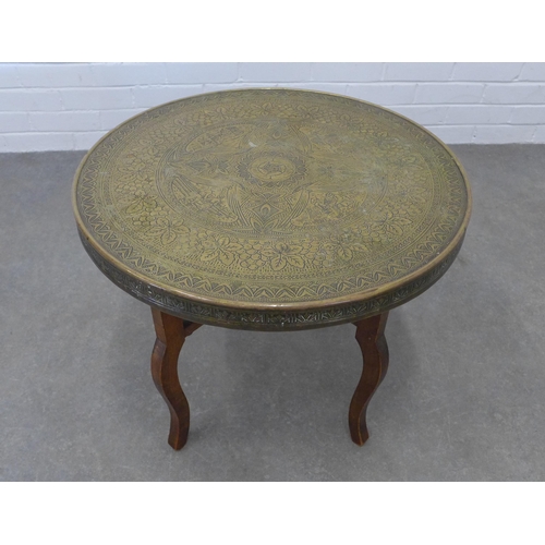 213 - Benares style table with circular engraved brass top,  50 x 60cm.