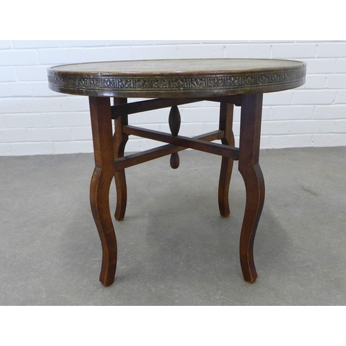 213 - Benares style table with circular engraved brass top,  50 x 60cm.