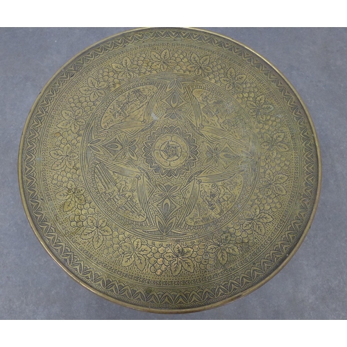 213 - Benares style table with circular engraved brass top,  50 x 60cm.