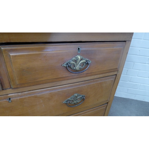 217 - Art nouveau mahogany dressing table with stylised triple mirror and pair of jewel drawers over a che... 