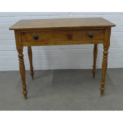 223 - Pine desk with rounded rectangular top above a frieze drawer, on ring turned legs, 76 x 93 x 52cm.