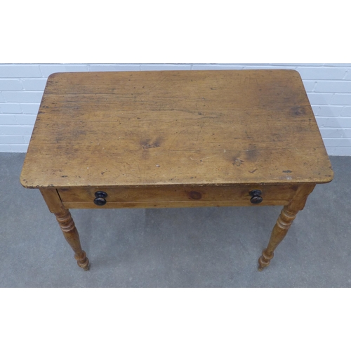 223 - Pine desk with rounded rectangular top above a frieze drawer, on ring turned legs, 76 x 93 x 52cm.