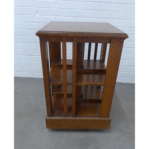 233 - An oak revolving bookcase of typical design. 77 x 49 x 49cm.