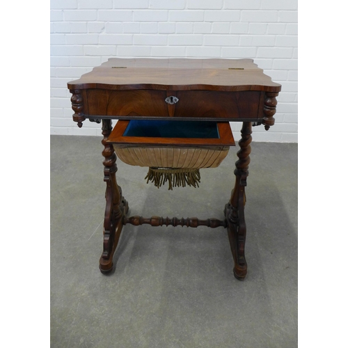 246 - 19th century rosewood sewing table, the serpentine top with a lift up section, opening to reveal a f... 