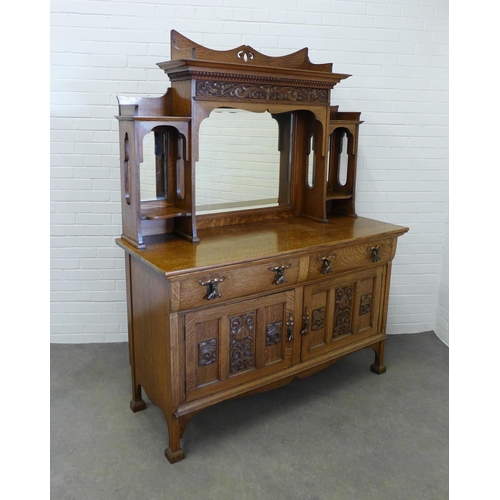 258 - Art Nouveau oak sideboard, with a ledgeback top above a dentil cornice with carved frieze and triple... 