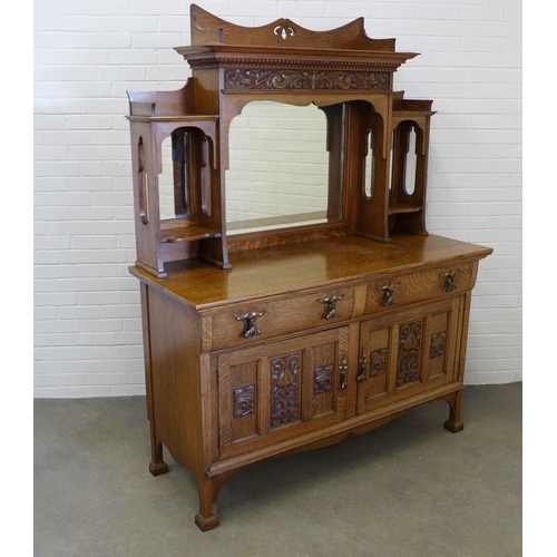 258 - Art Nouveau oak sideboard, with a ledgeback top above a dentil cornice with carved frieze and triple... 