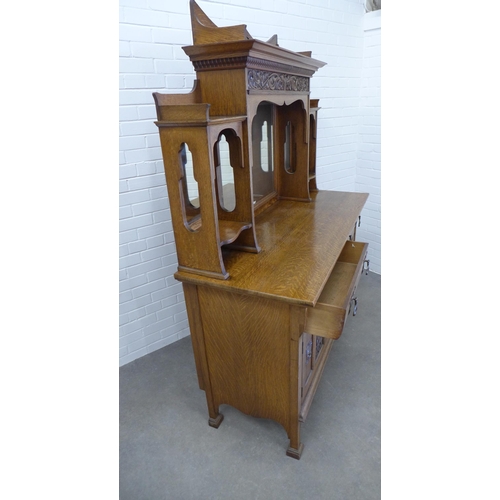 258 - Art Nouveau oak sideboard, with a ledgeback top above a dentil cornice with carved frieze and triple... 