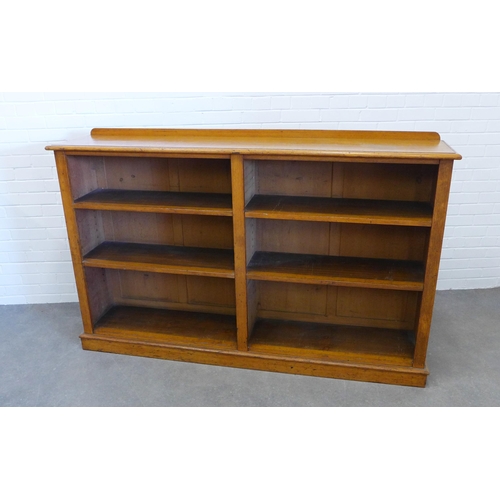 260 - Late 19th / early 20th century light oak open bookcase with two bays and a plinth base, 116 x 184 x ... 