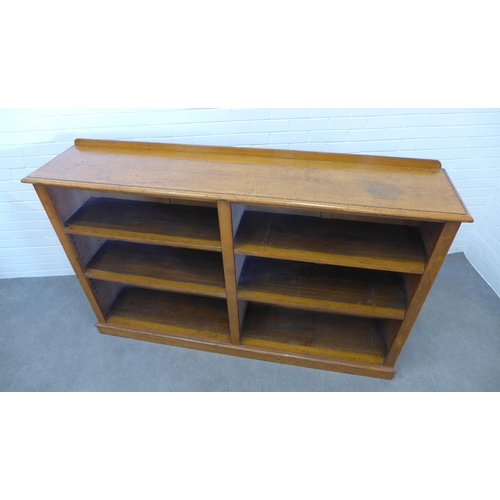 260 - Late 19th / early 20th century light oak open bookcase with two bays and a plinth base, 116 x 184 x ... 