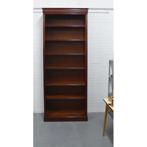 261 - Modern mahogany bookcase, of tall proportions, the cornice top over six shelves with reeded edges, o... 