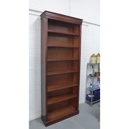 261 - Modern mahogany bookcase, of tall proportions, the cornice top over six shelves with reeded edges, o... 