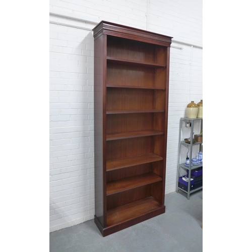 262 - Modern mahogany bookcase, of tall proportions, the cornice top over six shelves with reeded edges, o... 