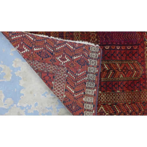 269 - Tekke prayer rug with red field and all-over geometric and serrated patterns,  135 x 127cm.