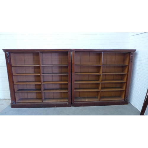 271 - Two mahogany open bookcases, each far end with moulded flowereheads, designed to sit beside each oth... 