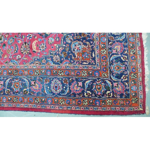 273 - Large Persian carpet with a central flowerhead medallion and allover foliate field, 250 x 350cm