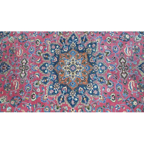 273 - Large Persian carpet with a central flowerhead medallion and allover foliate field, 250 x 350cm