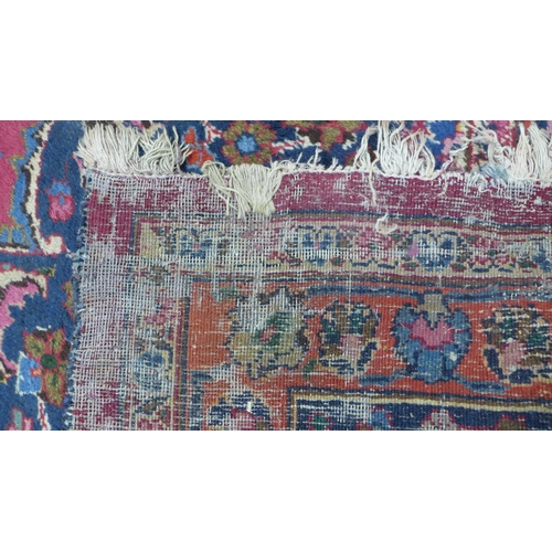 273 - Large Persian carpet with a central flowerhead medallion and allover foliate field, 250 x 350cm