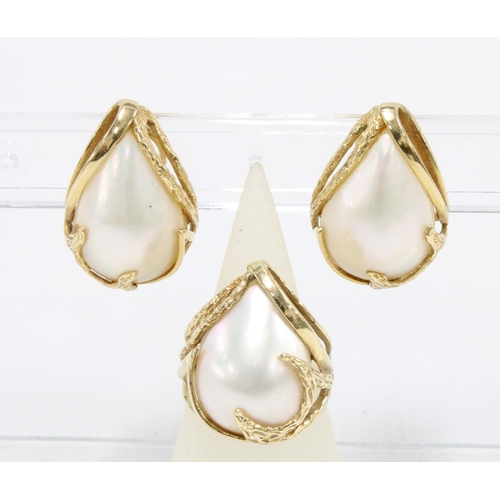 29 - A pair of 14ct gold and pearl earrings, stamped 14k 585 together with a matching dress ring size L1/... 