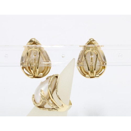 29 - A pair of 14ct gold and pearl earrings, stamped 14k 585 together with a matching dress ring size L1/... 
