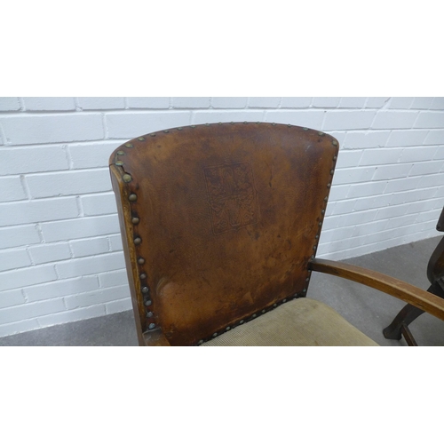 291 - Early 20th century oak  savonarola chair and another with open arms and embossed faux leather uphols... 