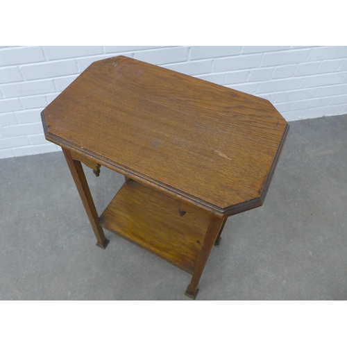 292 - Arts & Crafts oak table with an octagonal top and stylised frieze, on tapering legs with square pad ... 