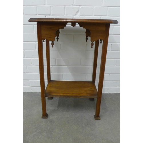 292 - Arts & Crafts oak table with an octagonal top and stylised frieze, on tapering legs with square pad ... 