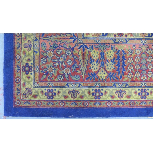 294 - Large Eastern carpet, blue field with central flowerhead medallion and multiple borders, 260 x 370cm... 