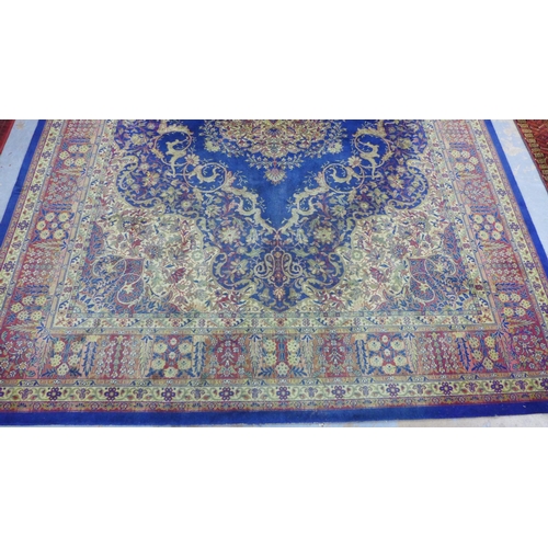 294 - Large Eastern carpet, blue field with central flowerhead medallion and multiple borders, 260 x 370cm... 