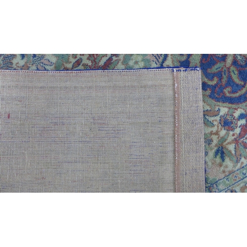 294 - Large Eastern carpet, blue field with central flowerhead medallion and multiple borders, 260 x 370cm... 