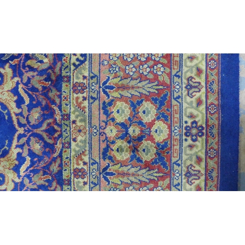 294 - Large Eastern carpet, blue field with central flowerhead medallion and multiple borders, 260 x 370cm... 