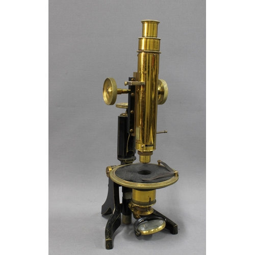 312 - Swift & Sons petrological microscope, in black and brass, 36cm tall