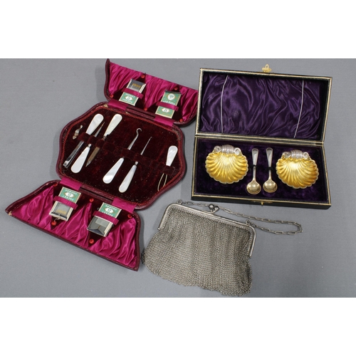 319 - Cased pair of silver plated and gilt salts, a mother of pearl handled manicure / sewing set (a/f) an... 