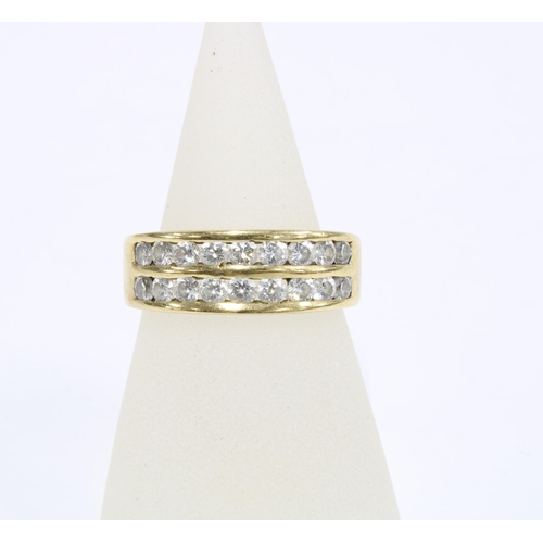 34 - 18ct gold diamond ring, chanel set with two rows of nine diamonds, stamped 750, size O