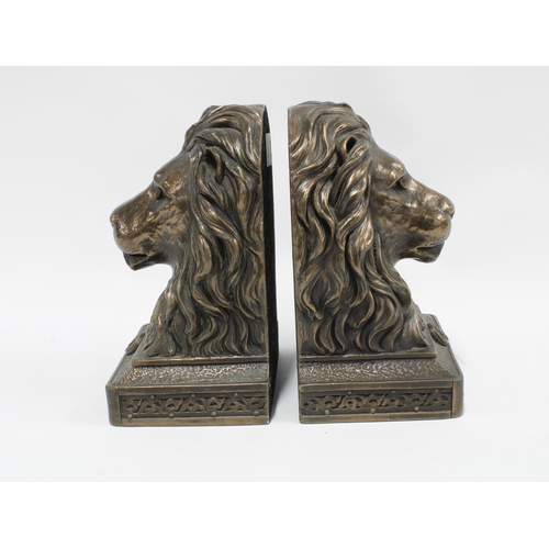 343 - A pair of modern Lions Head bookends,  faux bronze patinated resin, 19cm high (2)