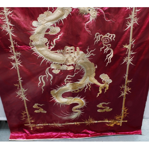 370 - Large Chinese silk panel embroidered with a dragon chasing the pearl of wisdom within a border of em... 