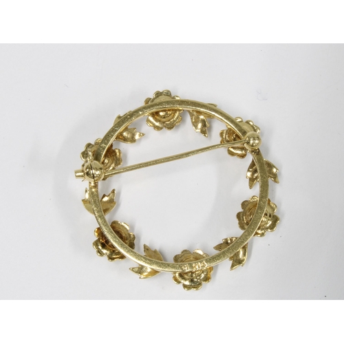 50 - 14ct gold pearl brooch, circular with six pearl flowerheads interspersed with leaves, stamped 14k, 3... 