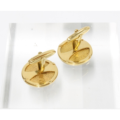 99 - A pair of Arabic gold coin cufflinks mounted in unmarked yellow metal (2)