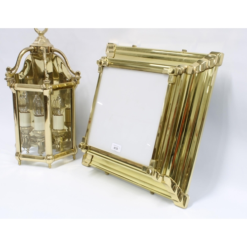 410 - Heavy brass lantern style wall light with glazed panels and three internal candle style light fittin... 