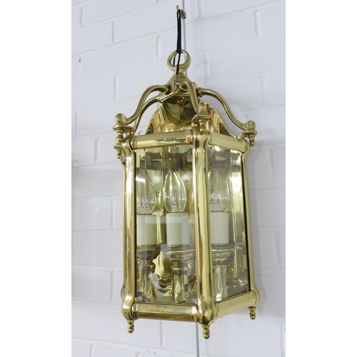 412 - Pair of heavy brass lantern style wall lights with glazed panels, three internal candle style lights... 