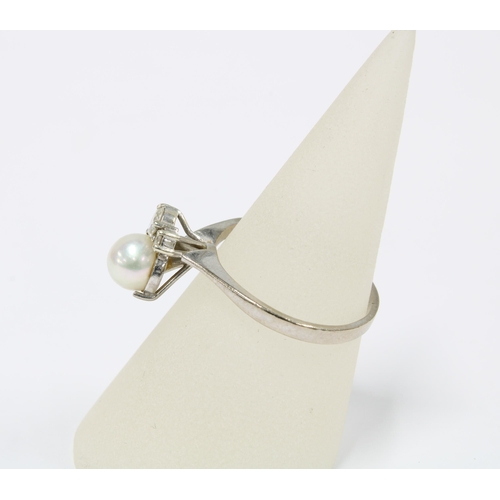 1 - Pearl and diamond ring, the large cultured pearl offset by two brilliant cut diamonds, on a plain wh... 