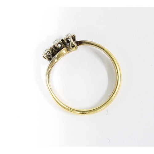16 - 18ct gold three stone diamond crossover ring, size N