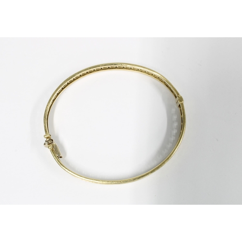 27 - 9ct gold bangle with pierced greek key design, stamped 375